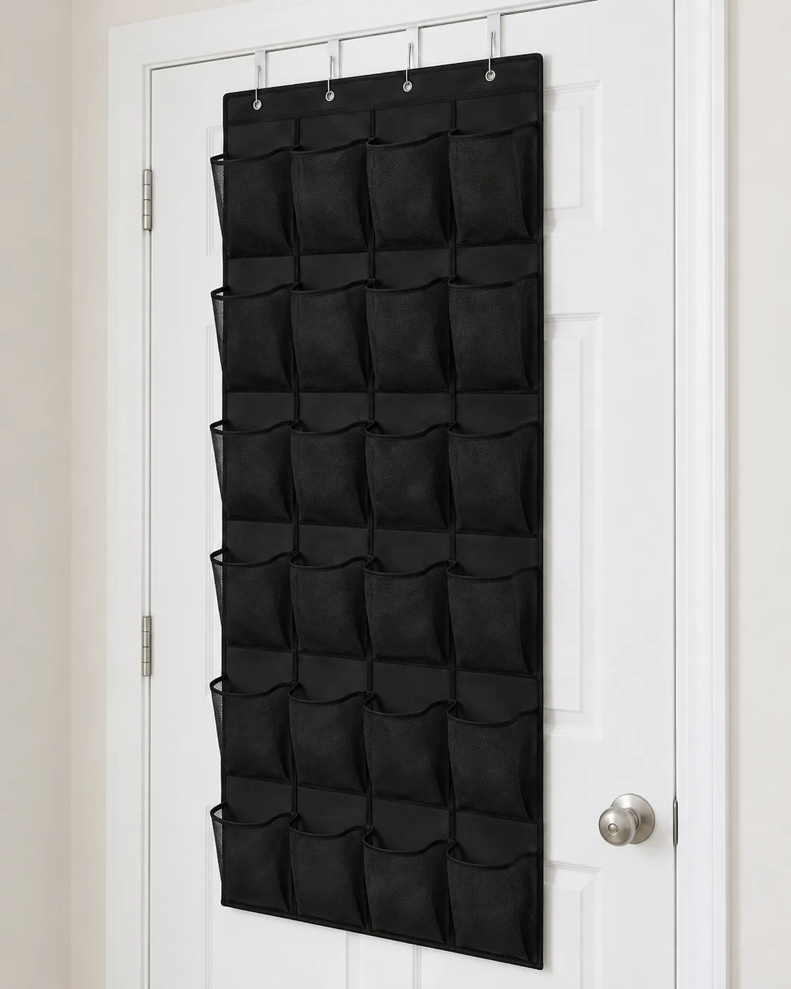 Full black twenty-four-pocket organizer mounted with four white over-door hooks