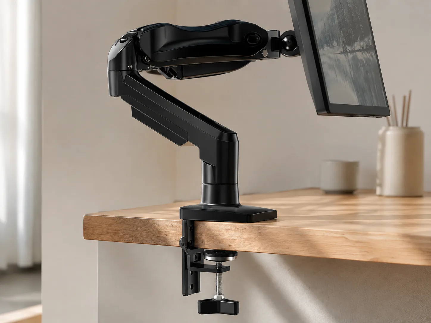 Close-up of the C-clamp secured to a desk edge