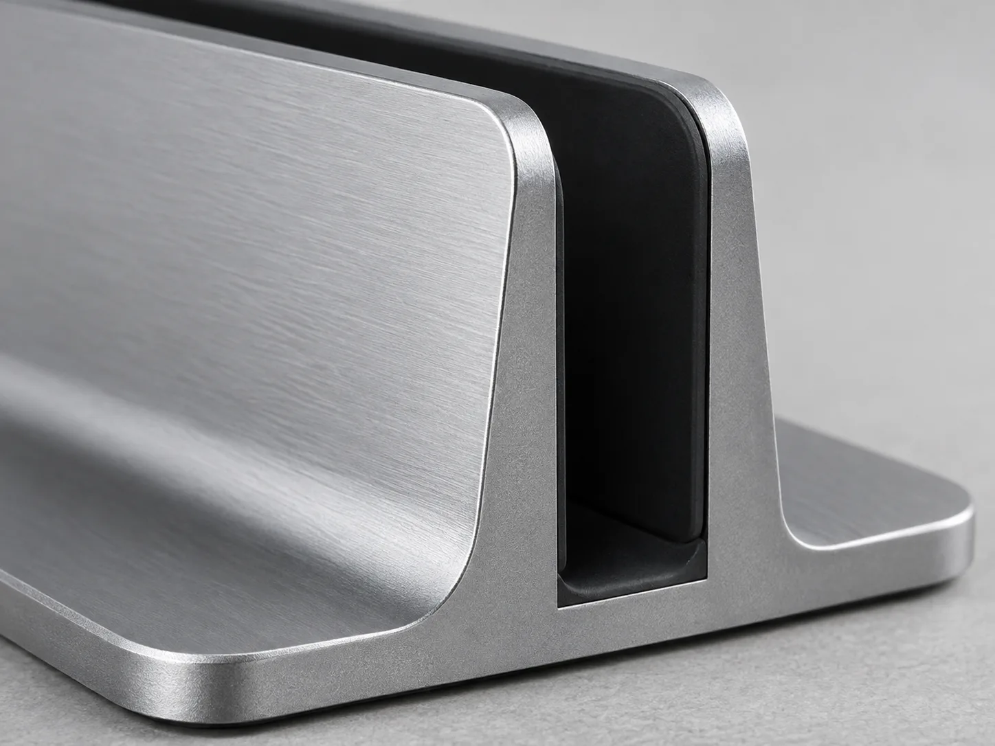 Side view of aluminum vertical laptop stand footprint