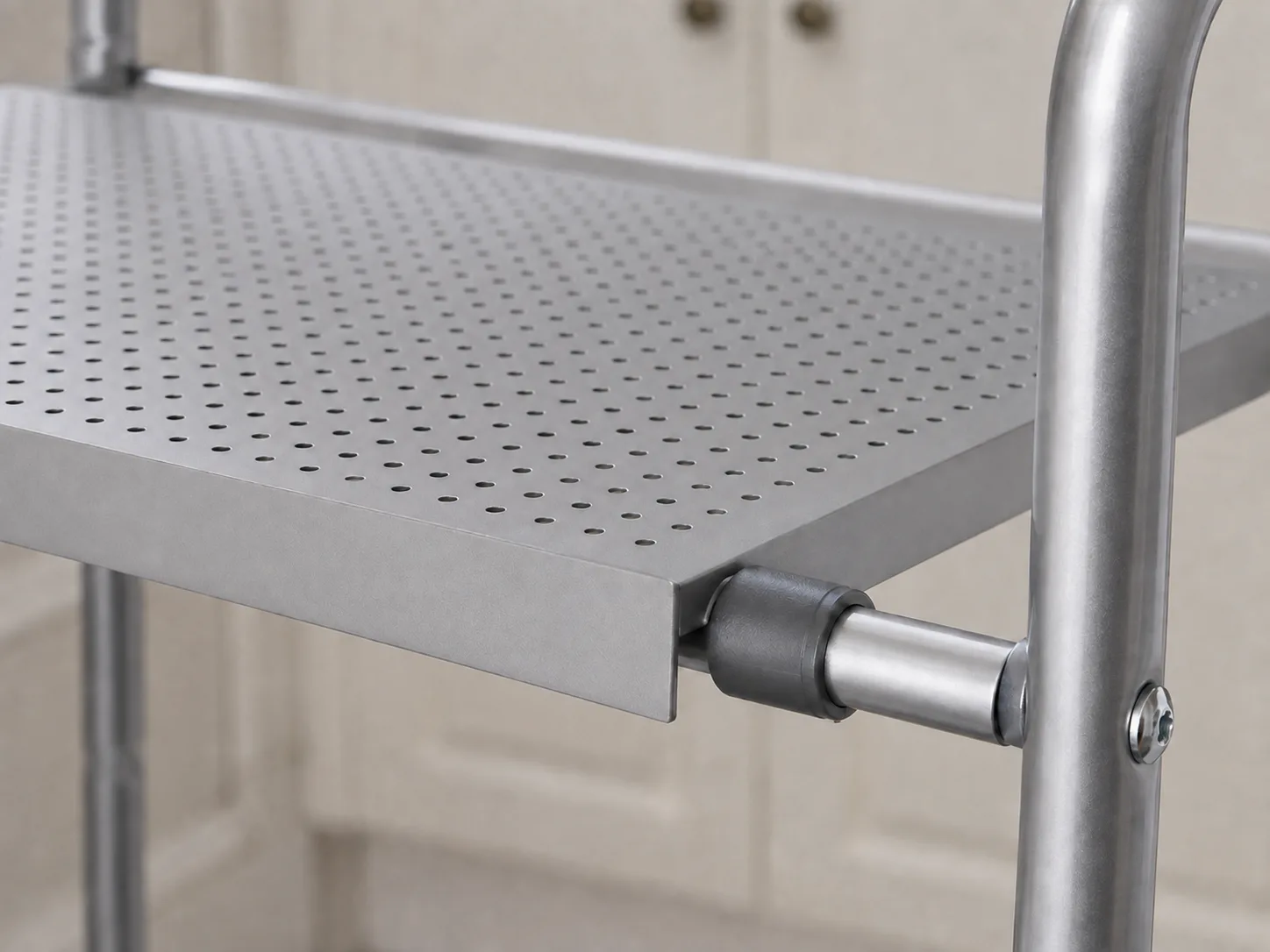Close-up of the perforated shelf panel and frame connection