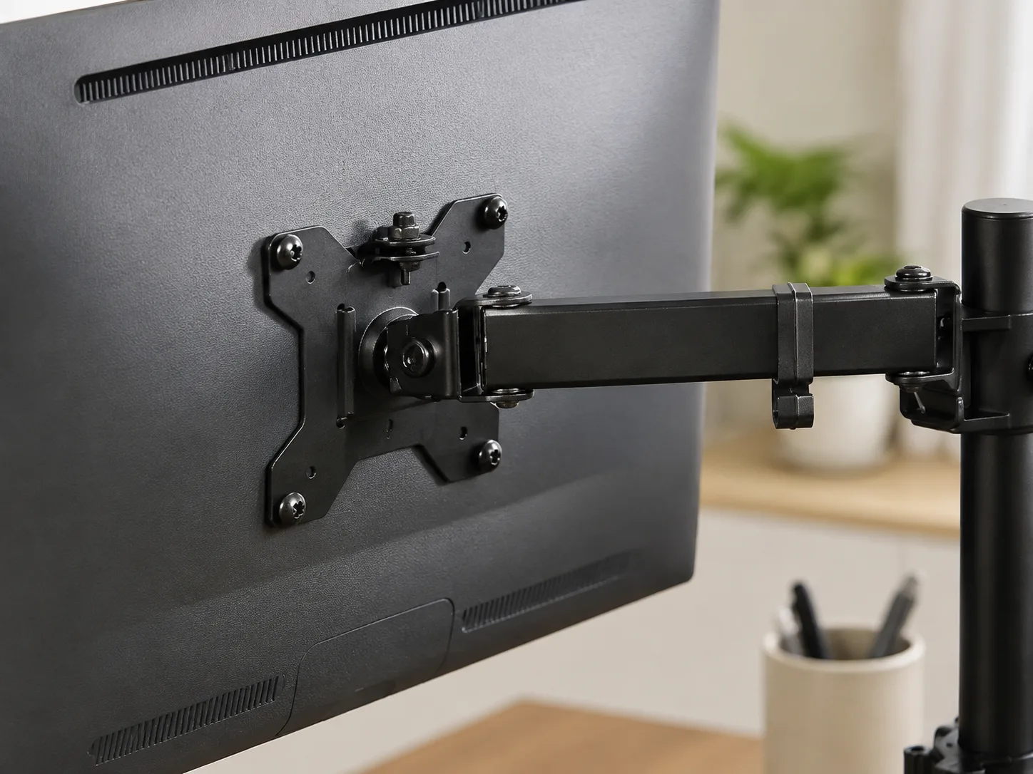 Close-up of the monitor mounting plate and screws