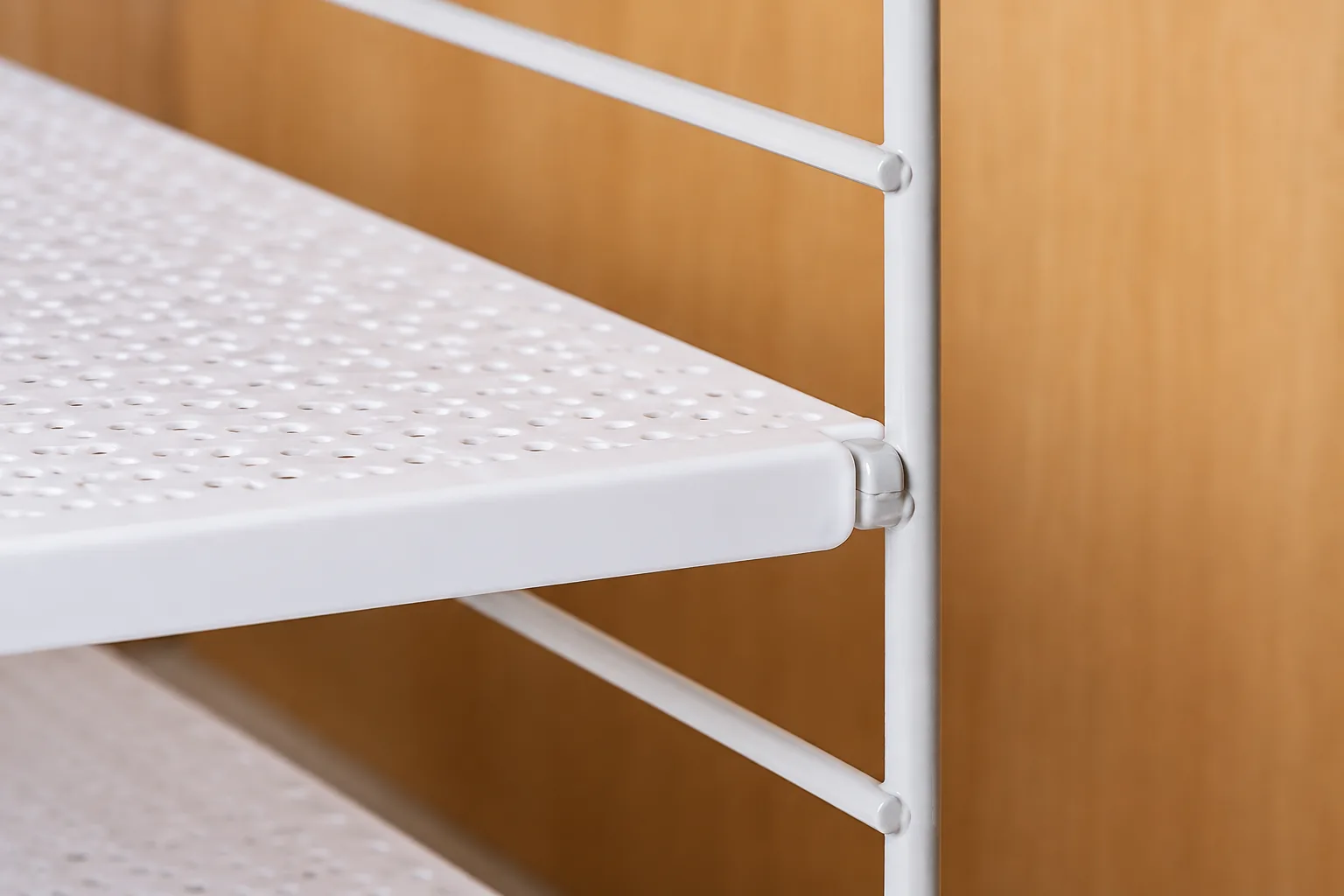 Close-up of an adjustable shelf connection